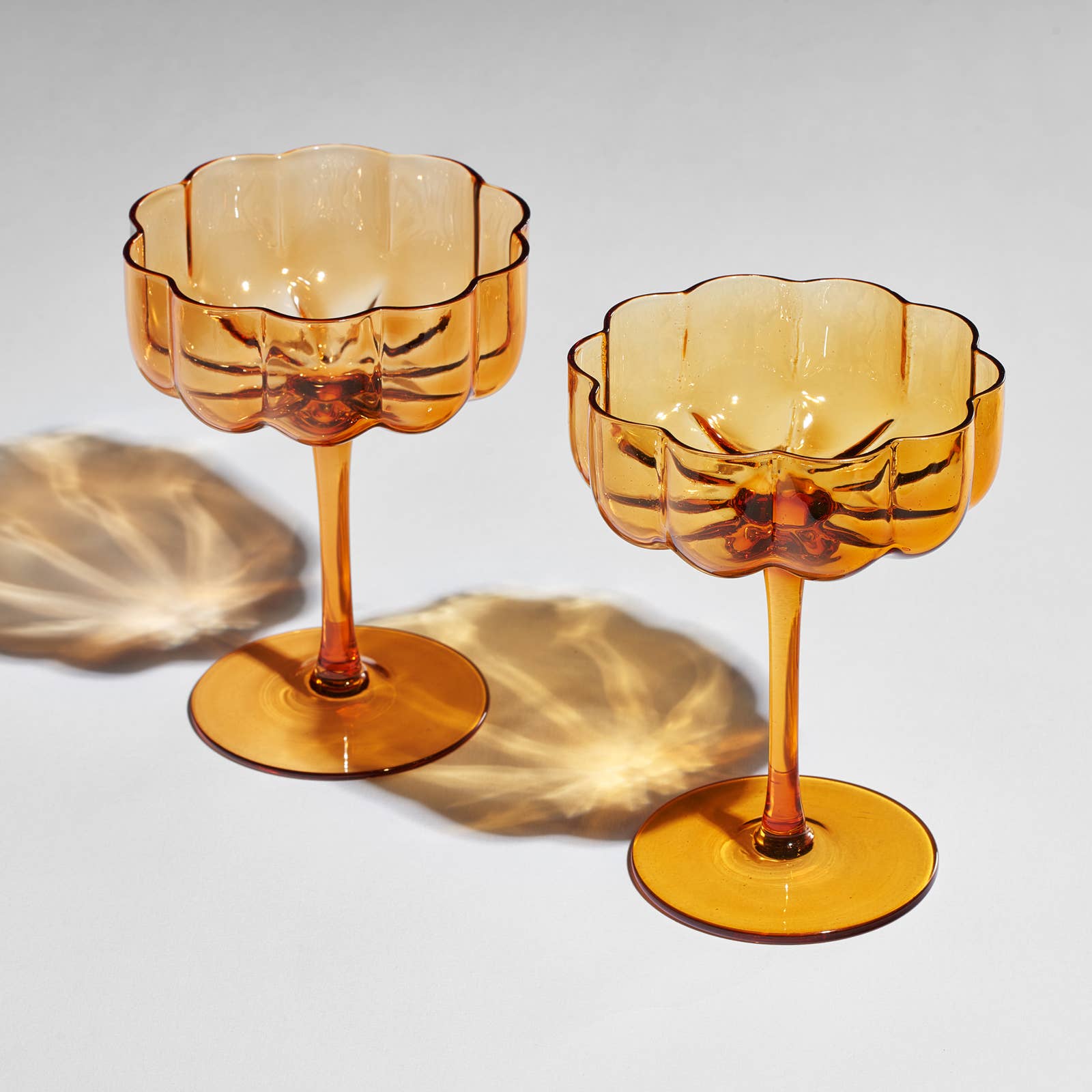 Pair of Amber Flower Wave Glasses Coupes